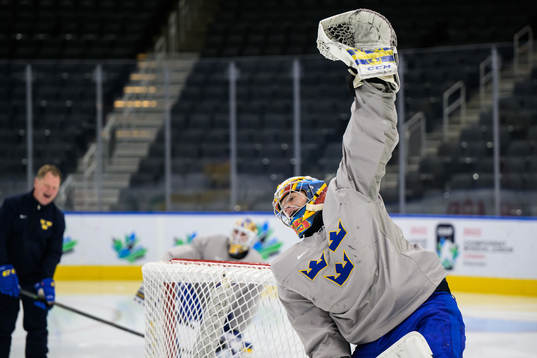 Goaltender Carl Lindbom of Sweden celebrates at a practice