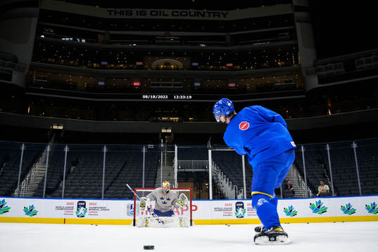 Goaltender Carl Lindbom and Isak Rosén of Sweden at a