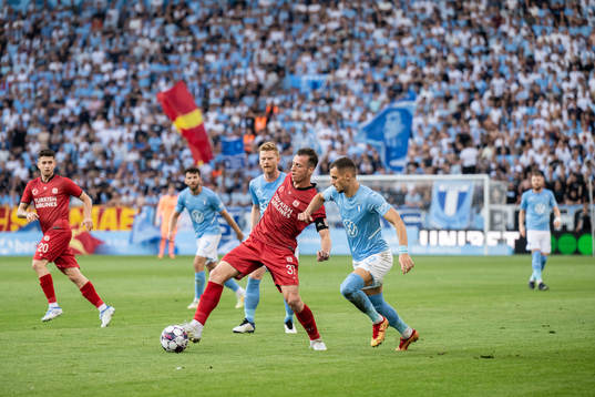 Hakan Arslan of Sivasspor and Veljko Birmancevic of Malmö