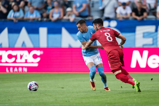 Veljko Birmancevic of Malmö FF and Robin Yalcin of