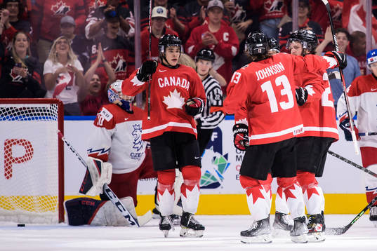 Olen Zellweger, Kent Johnson and Mason McTavish of Canada