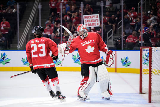 Mason McTavish and goaltender Dylan Garand of Canada