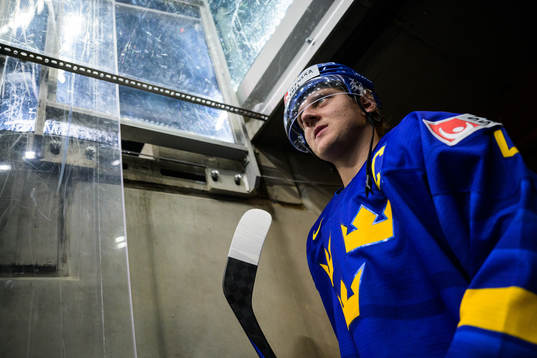Emil Andrae of Sweden walks out to the ice for warm-up