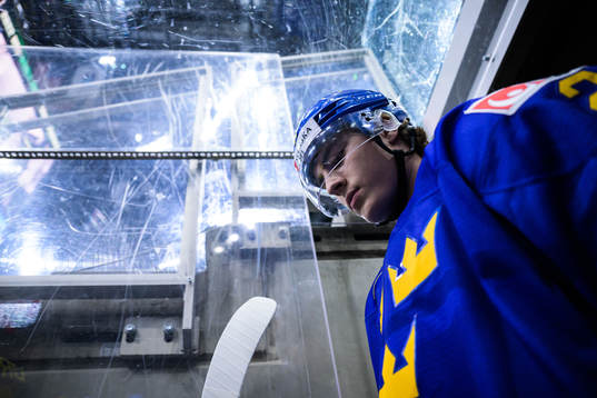 Liam Öhgren of Sweden walks out to the ice for warm-up