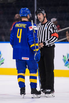 Emil Andrae of Sweden talks to referee Kyle Kowalski