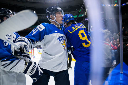 Aatu Räty of Finland tackles Daniel Ljungman of Sweden