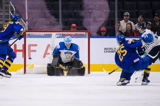 Liam Öhgren of Sweden shoots against goaltender Juha