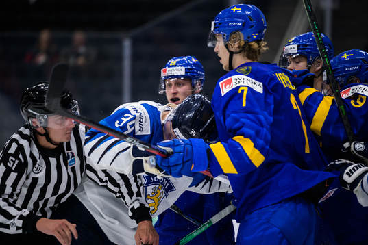 Aatu Räty of Finland in a fight against Simon Edvinsson of