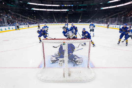 Kasper Puutio of Finland scores 0-1 behind goaltender