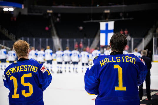 Åke Stakkestad and goaltender Jesper Wallstedt of Sweden