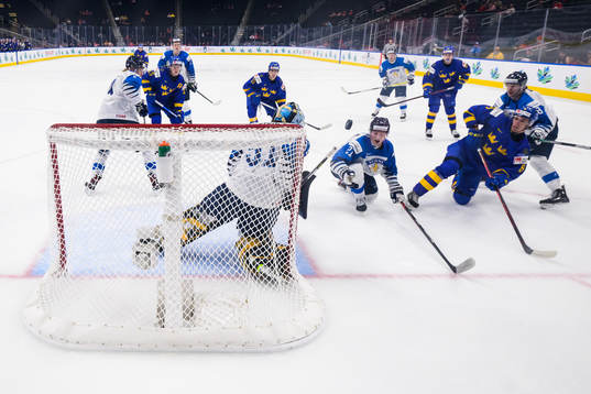 Leo Lööf of Sweden shoots the puck against goaltender