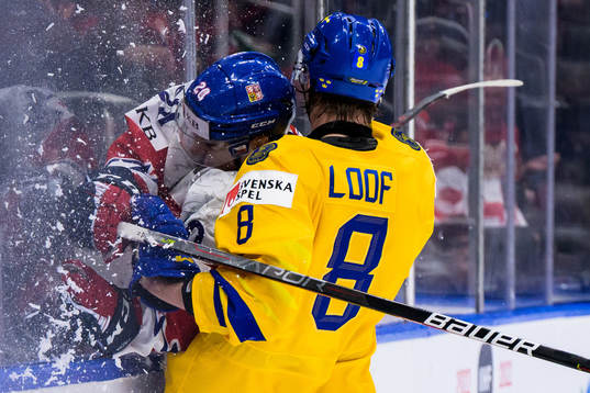 Tomas Urban of Czech Republic gets tackled by Leo Lööf of