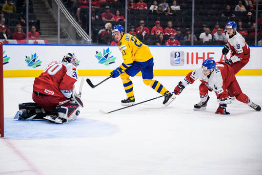 Goaltender Tomas Suchanek, Jiri Tichacek and Ivan Ivan of