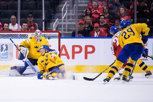 Goaltender Jesper Wallstedt and Åke Stakkestad of Sweden