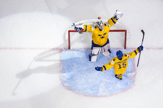 Goaltender Jesper Wallstedt and Åke Stakkestad of Sweden