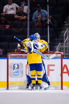 Goaltender Jesper Wallstedt and Åke Stakkestad of Sweden