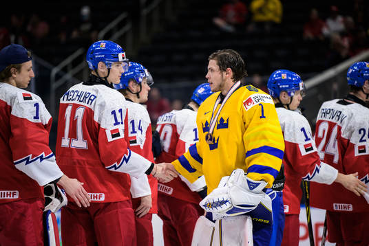 Goaltender Jesper Wallstedt of Sweden greets Czech players