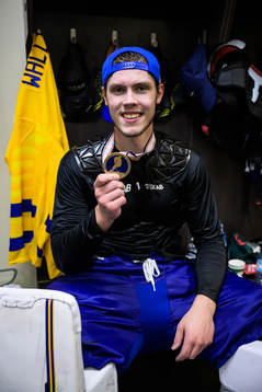 Goaltender Jesper Wallstedt of Sweden poses with his bronze