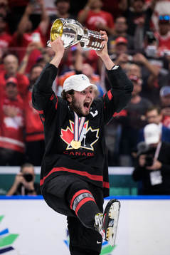Mason McTavish of Canada celebrates with the winner’s