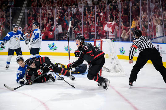 Kent Johnson of Canada celebrates
