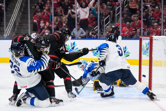 Kent Johnson of Canada scores the game winning 3-2 goal in
