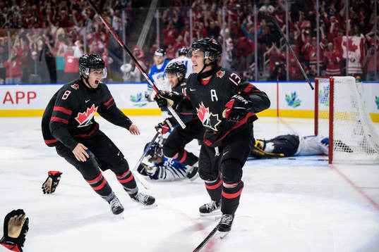 Ronan Seeley and Kent Johnson of Canada celebrate the game