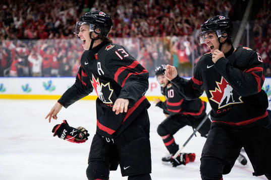 Kent Johnson and Ronan Seeley of Canada celebrate the game