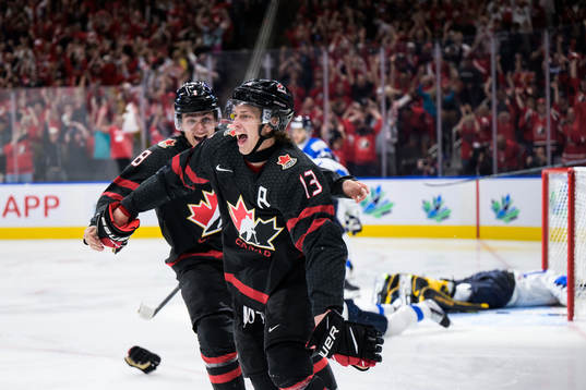 Ronan Seeley and Kent Johnson of Canada celebrate the game