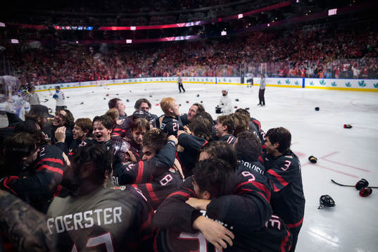 Players of Canada celebrate the game winning 3-2 goal in