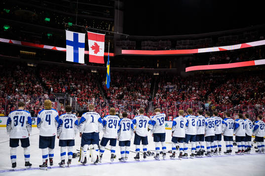 The flags of Finland, Canada and Sweden are hoisted in