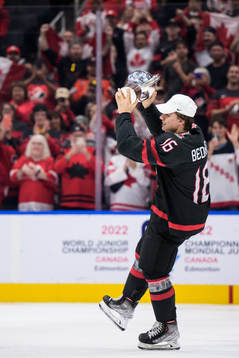 Connor Bedard of Canada celebrates with the winner’s