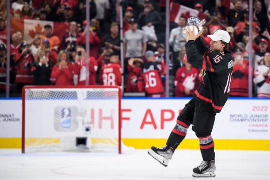 Connor Bedard of Canada celebrates with the winner’s