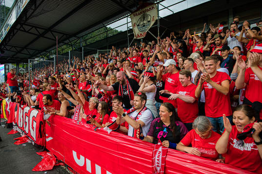 Spectators in the stands celebrates