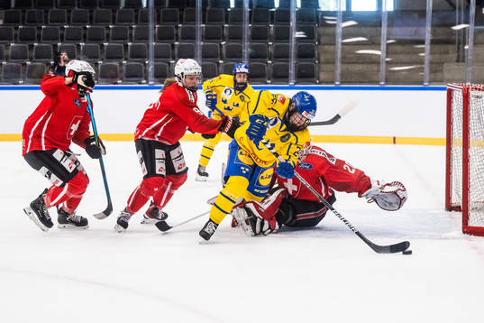 Lina Ljungblom of Sweden and goaltender Andrea Braendli of