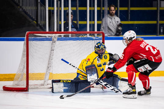 goaltender Ida Boman of Sweden and Dominique Ruegg of