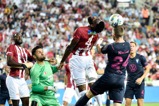 Aaron Appindangoye of Sivasspor and Lasse Nielsen of Malmö