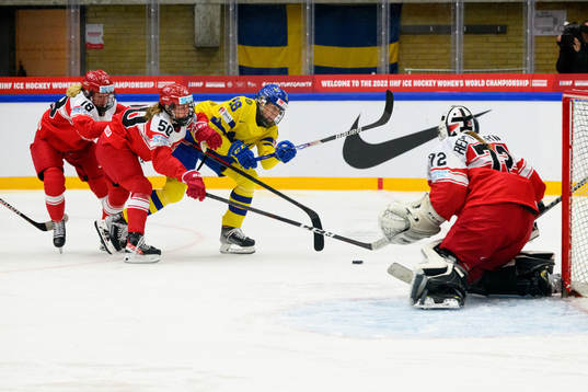 Maria Peters and Mia Bau of Denmark against Hanna Olsson of