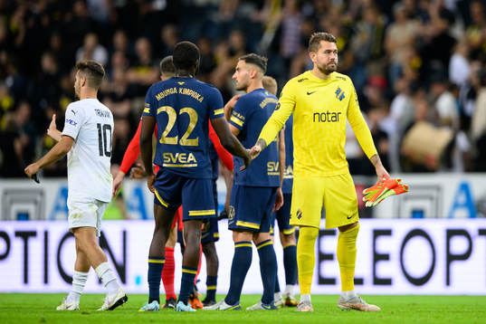 Benjamin Mbunga Kimpioka and goalkeeper Kristoffer
