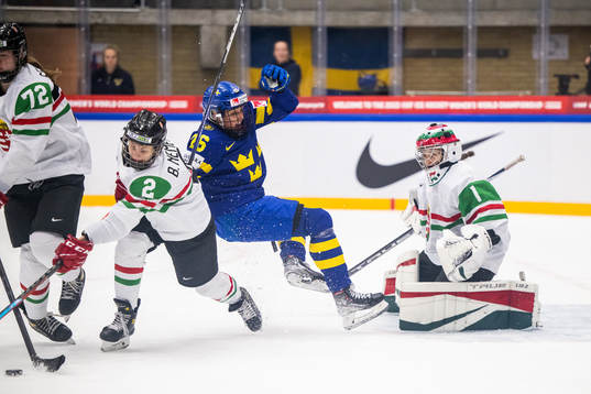 Bernadett Nemeth and goaltender Aniko Nemeth of Hungary and
