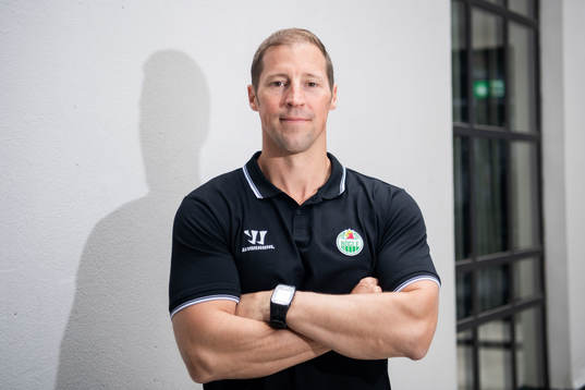 Cam Abott, head coach of Rögle, poses for portrait
