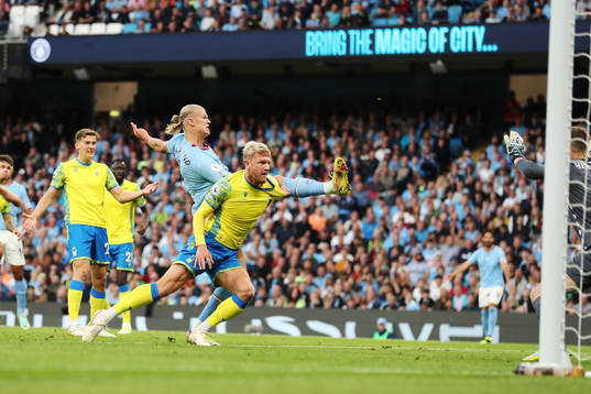 Erling Braut Haaland of Manchester City scores