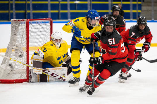 Goaltender Emma Söderberg, Jessica Adolfsson of Sweden and