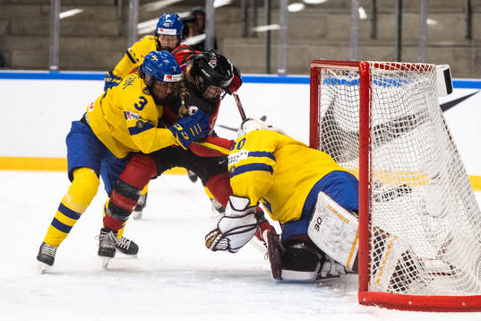 Anna Kjellbin and goaltender Emma Söderberg of Sweden and