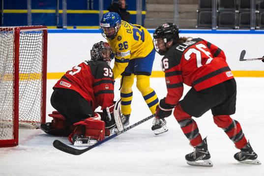 goaltender Ann-Renee Desbiens of Canada and Hanna Olsson of