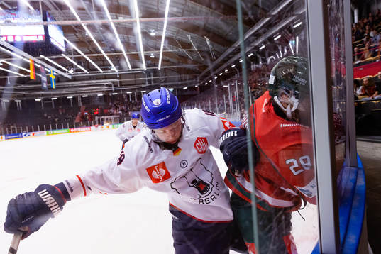 Jonas Müller of Eisbären Berlin and Anthony Greco  of