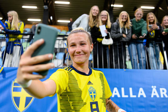 Marika Bergman Lundin of Sweden takes pictures with the