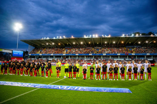 Players of Belgium and Norway line up