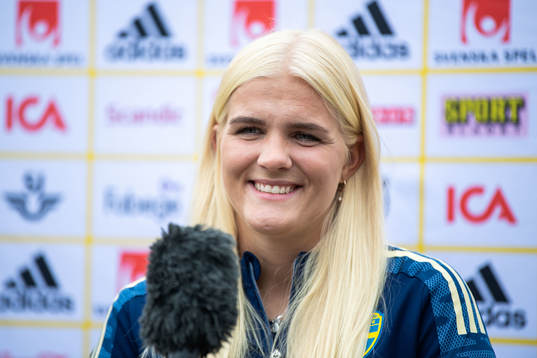Goalkeeper Emma Holmgren is interviewed by the media