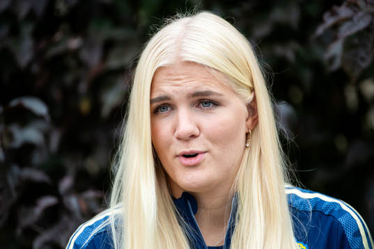Goalkeeper Emma Holmgren is interviewed by the media