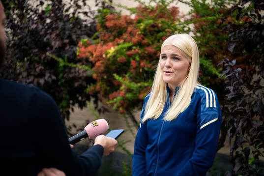 Goalkeeper Emma Holmgren is interviewed by the media
